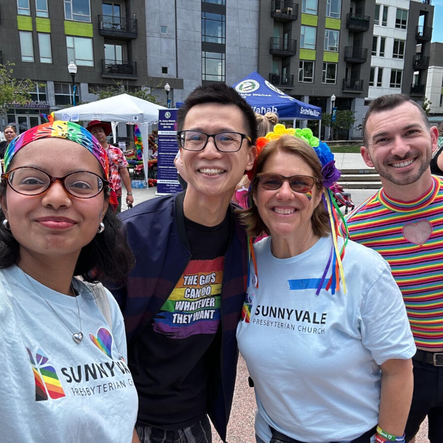 Four adults from Sunnyvale Pres posing for a group selfie